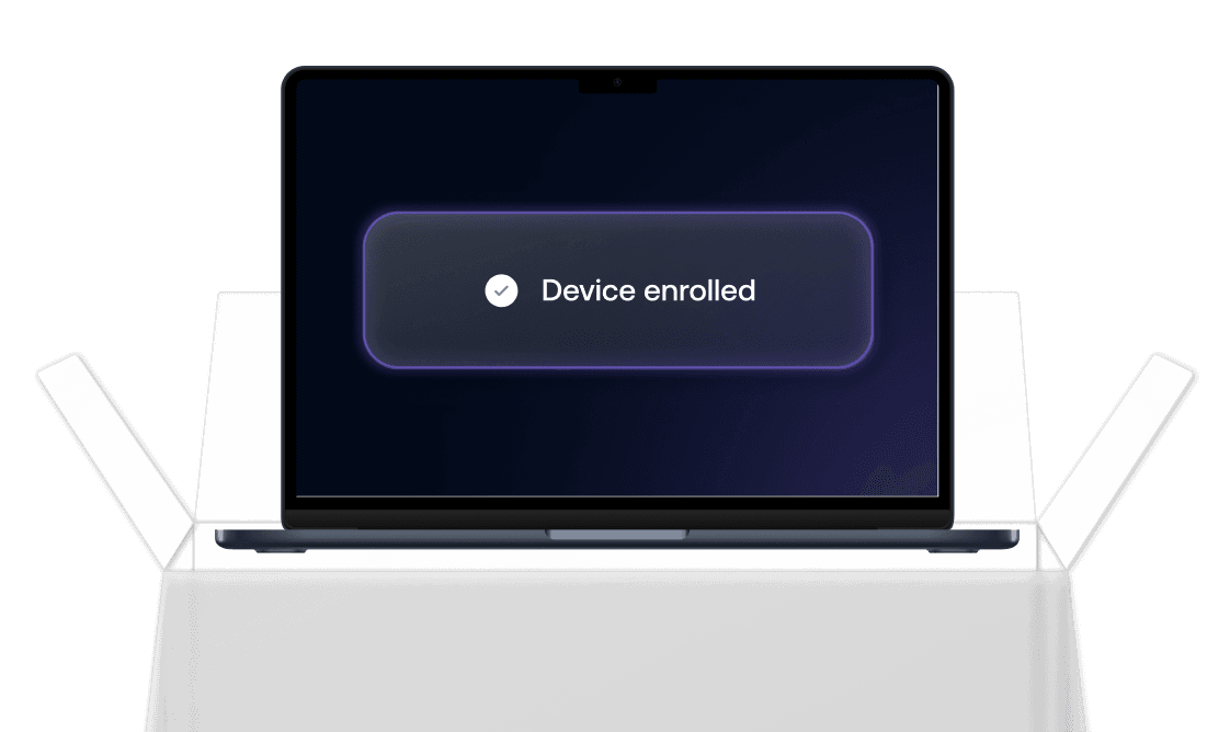 A Mac laptop screen showing a glowing “Device enrolled” confirmation banner, indicating successful macOS enrollment.