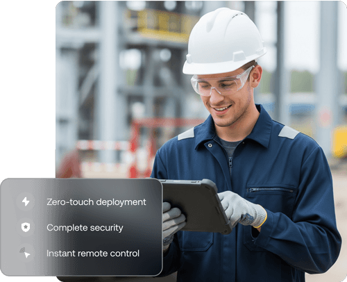 Image of a smiling worker in a hard hat and safety glasses using a tablet, representing Hexnode’s purpose built management and zero-touch deployment for rugged devices in field operations.