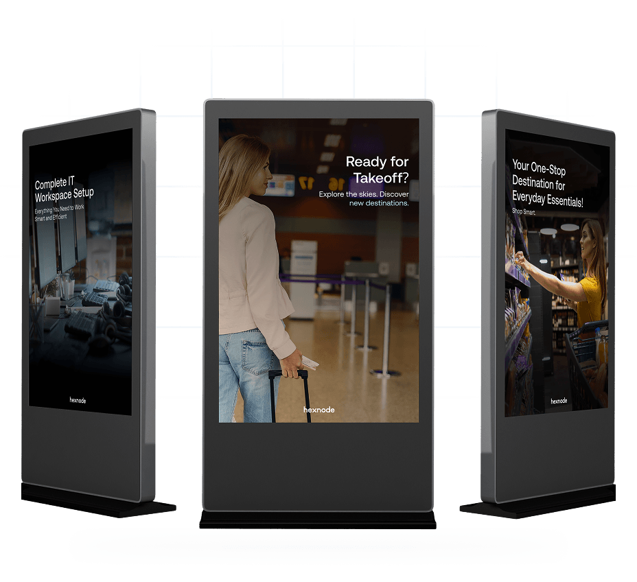 Three digital signage displays showing promotional content, including messages about IT setup and travel